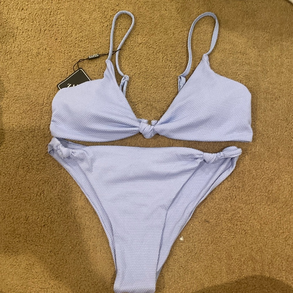 Light blue bathing suit for sale! Never worn before.